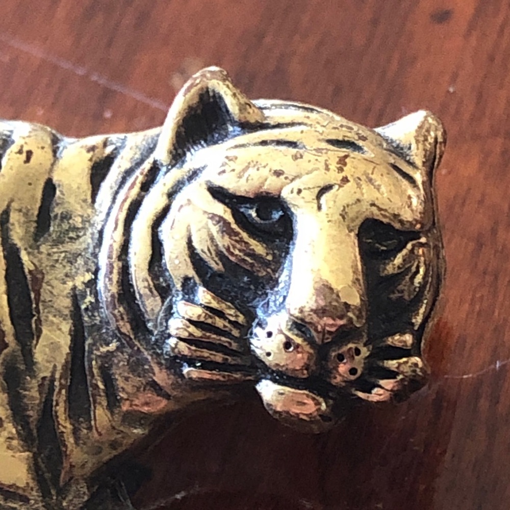 vintage figural tiger brooch with a crouching or leaping design